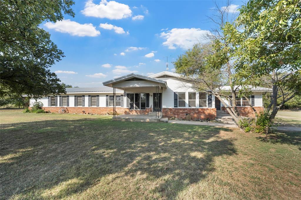 12145 Tree Lake Drive Waco, TX 76708 - Photo 2 of 40 a front view of a house with a garden
