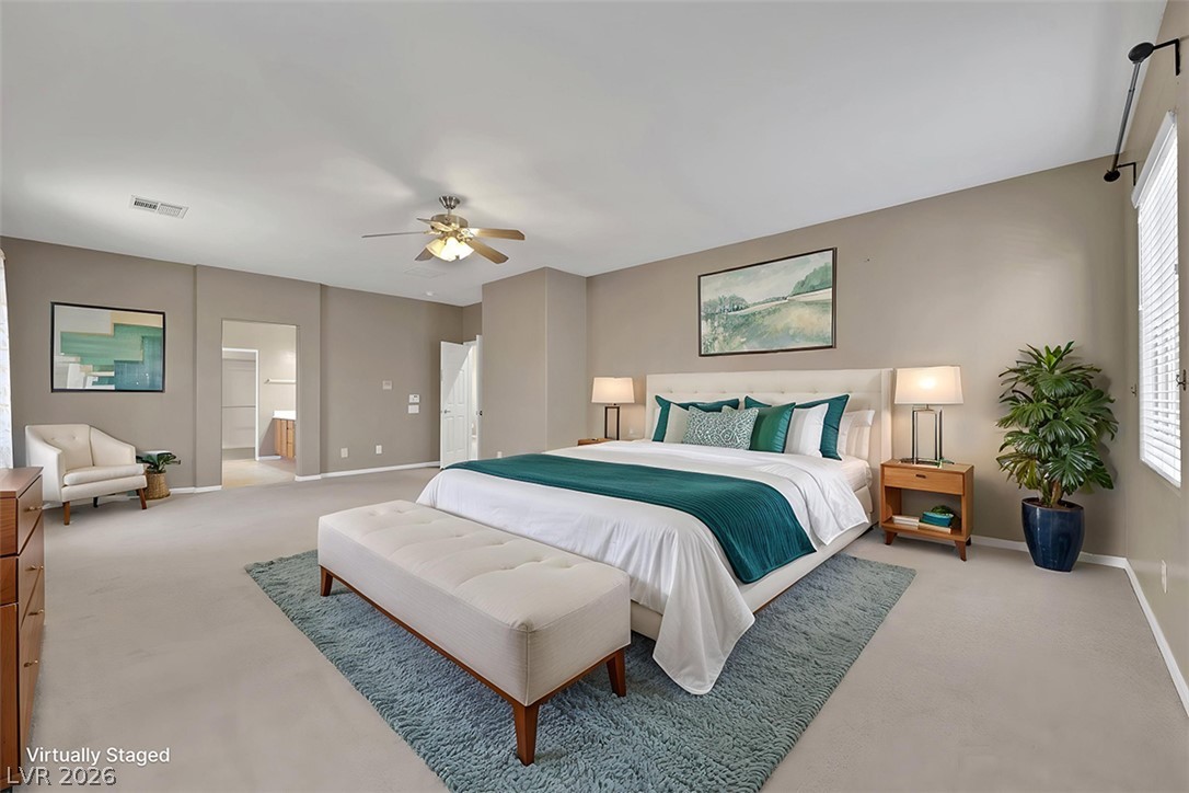 2501 Bechamel Place Henderson, NV 89044 - Photo 36 of 50 An inviting primary bedroom, designed for rest and rejuvenation, features a subtle ceiling fan for optimal air circulation.