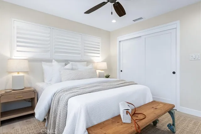 a bathroom with a sink mirror and vanity