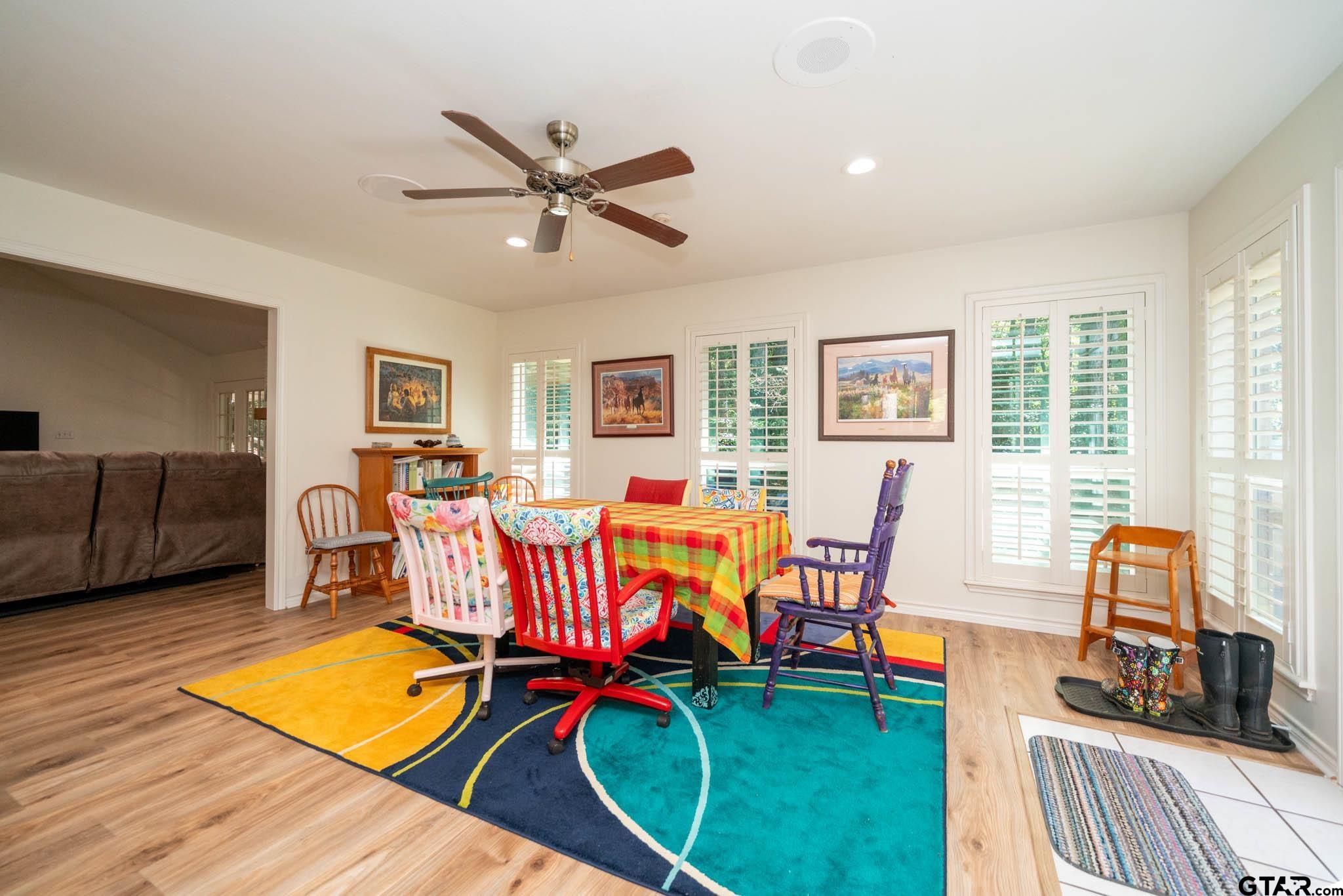 431 Gifford Street Rusk, TX 75785 - Photo 12 of 48 a living room with furniture and a dining table with wooden floor