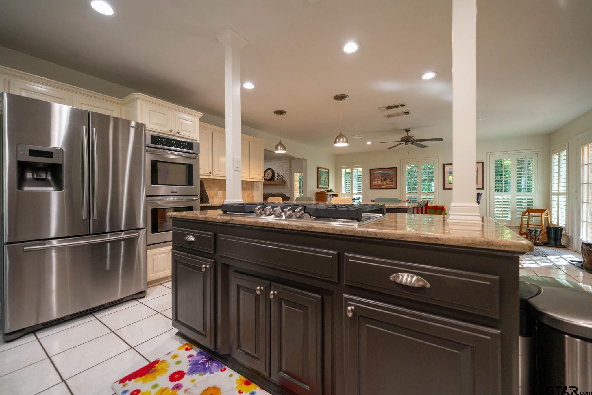 431 Gifford Street Rusk, TX 75785 - Photo 18 of 48 a kitchen with stainless steel appliances granite countertop a refrigerator and a sink
