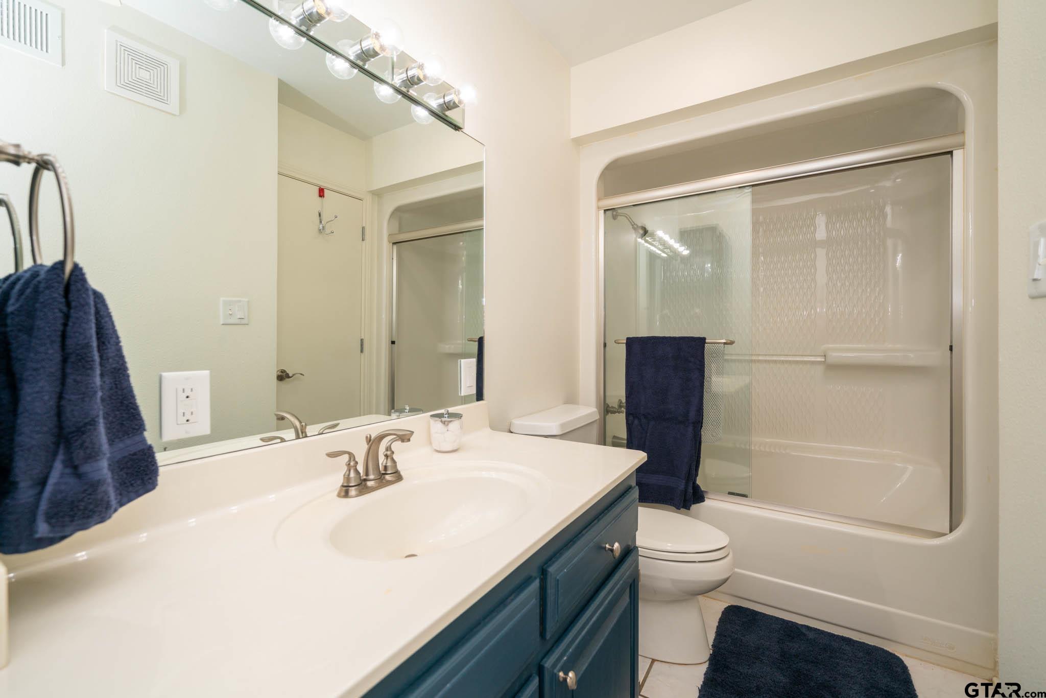 431 Gifford Street Rusk, TX 75785 - Photo 30 of 48 a bathroom with a sink a toilet and shower