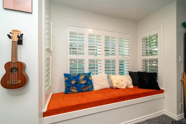 a bedroom with a workspace