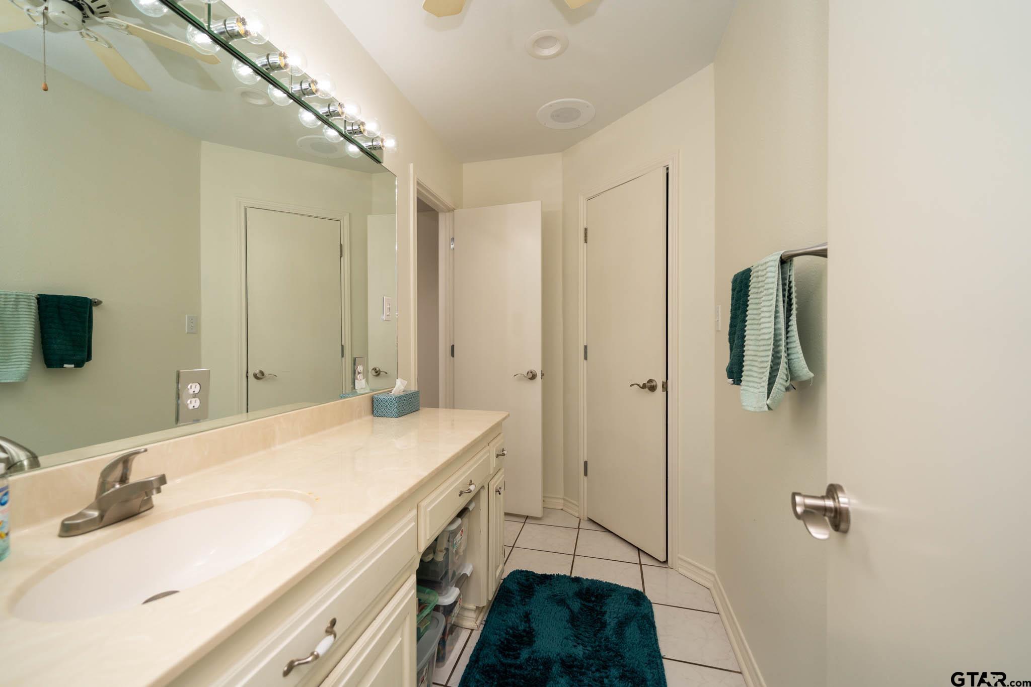 431 Gifford Street Rusk, TX 75785 - Photo 41 of 48 a bathroom with a sink and a mirror