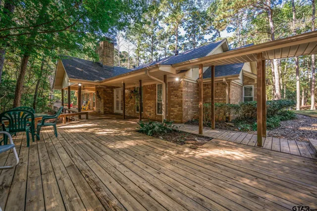 a wooden bench sitting in the middle of a park
