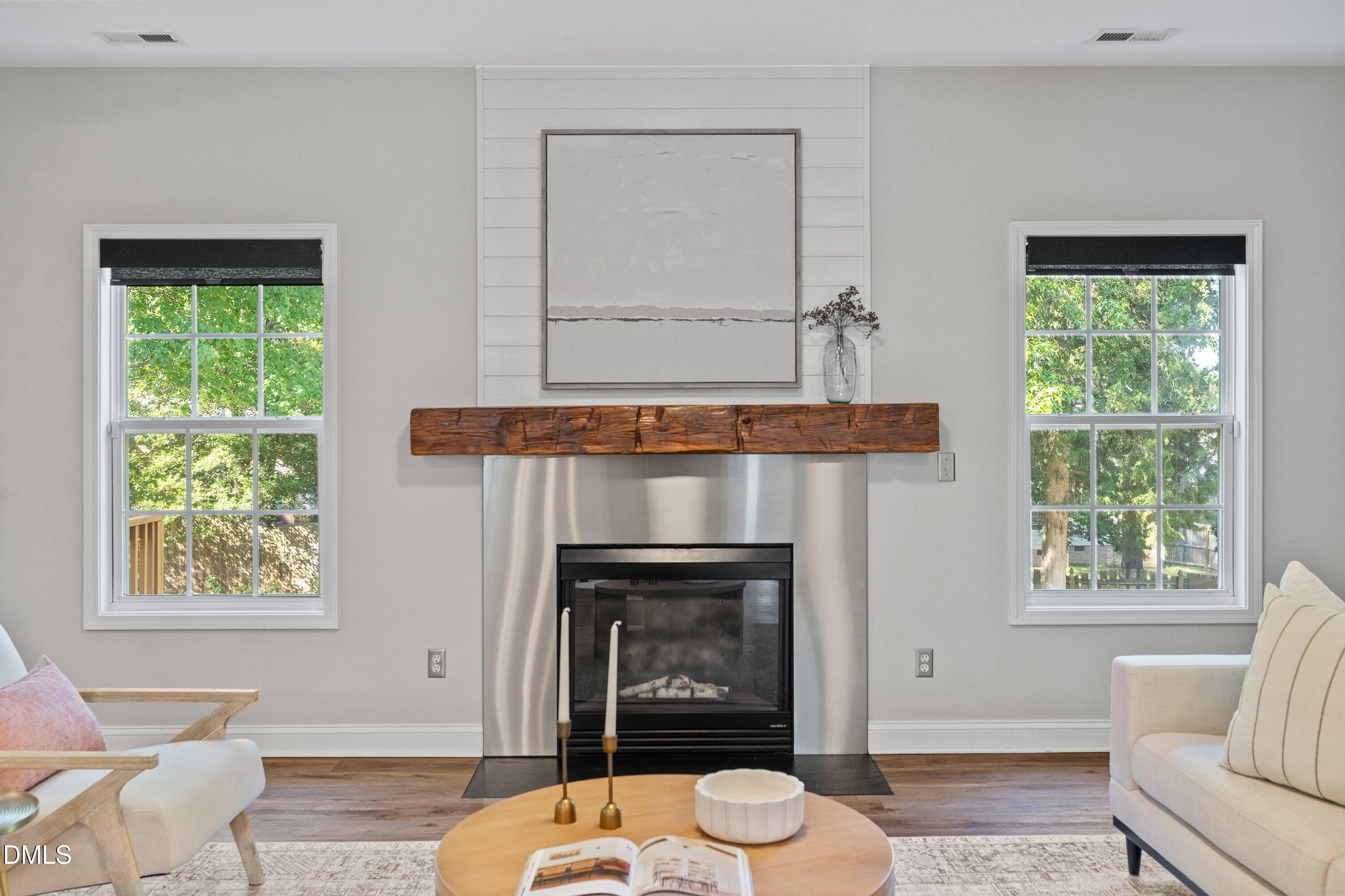 3717 Windmeade Road Wake Forest, NC 27587 - Photo 15 of 51 a living room with furniture and a fireplace