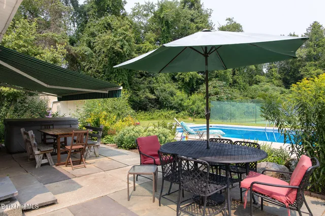 a patio with a patio table and chairs