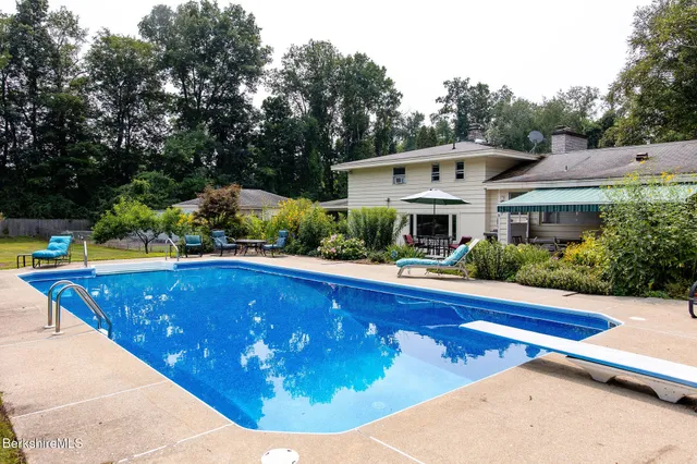 a view of a swimming pool with a patio