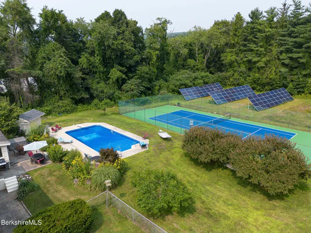 a view of an outdoor space pool patio and outdoor seating