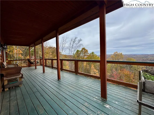 a view of a balcony with wooden floor