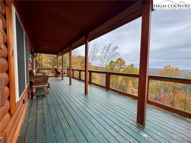 a view of a balcony with wooden floor