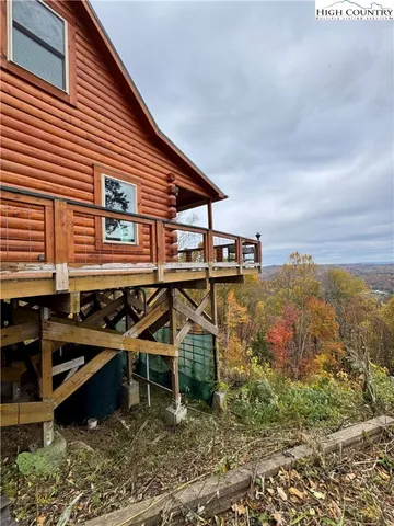 a view of a house with yard and sitting area