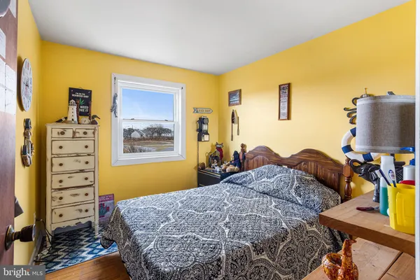 a bedroom with a bed and furniture