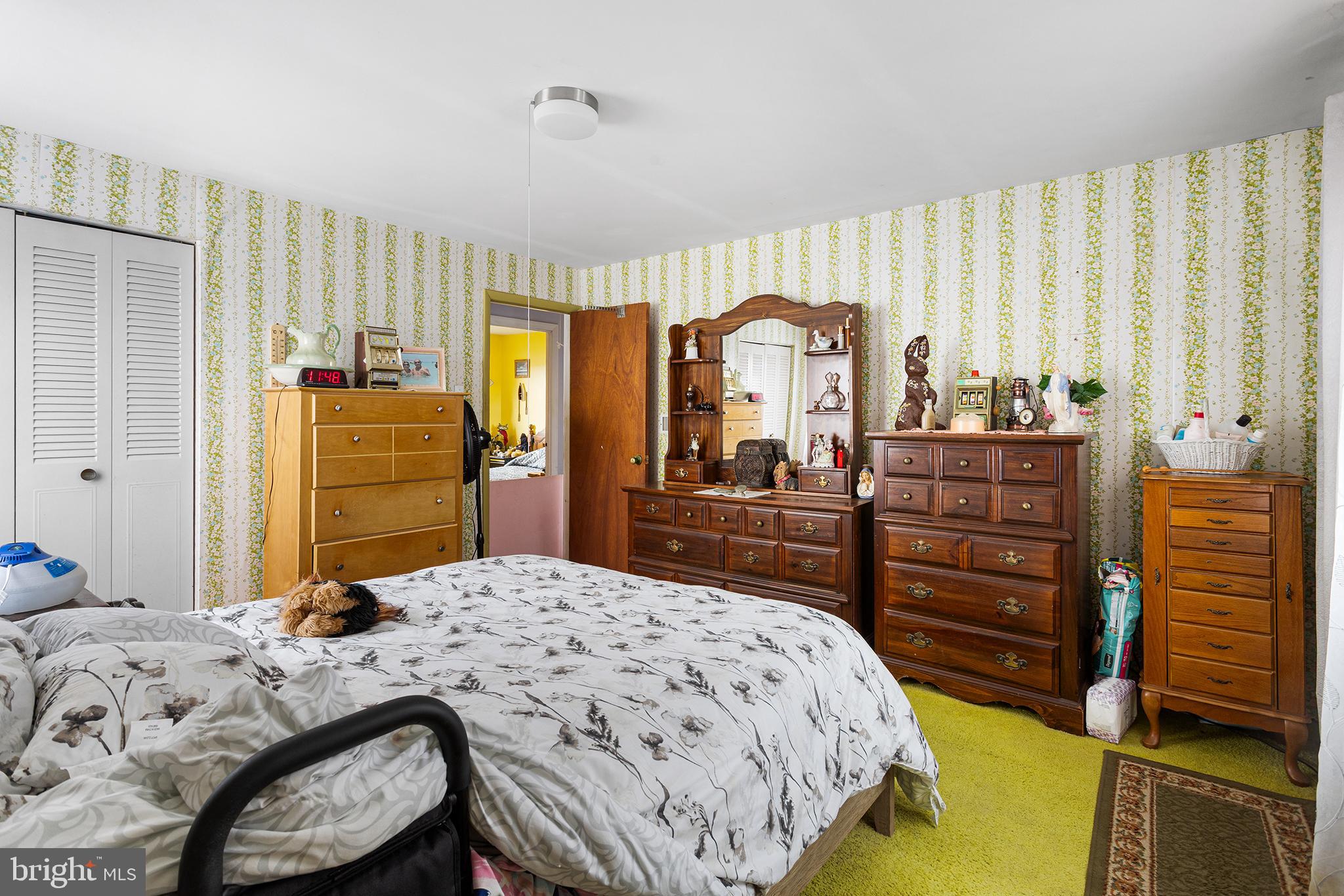 45 Heald Road Brigantine, NJ 08203 - Photo 22 of 25 a bedroom with a bed and a dresser
