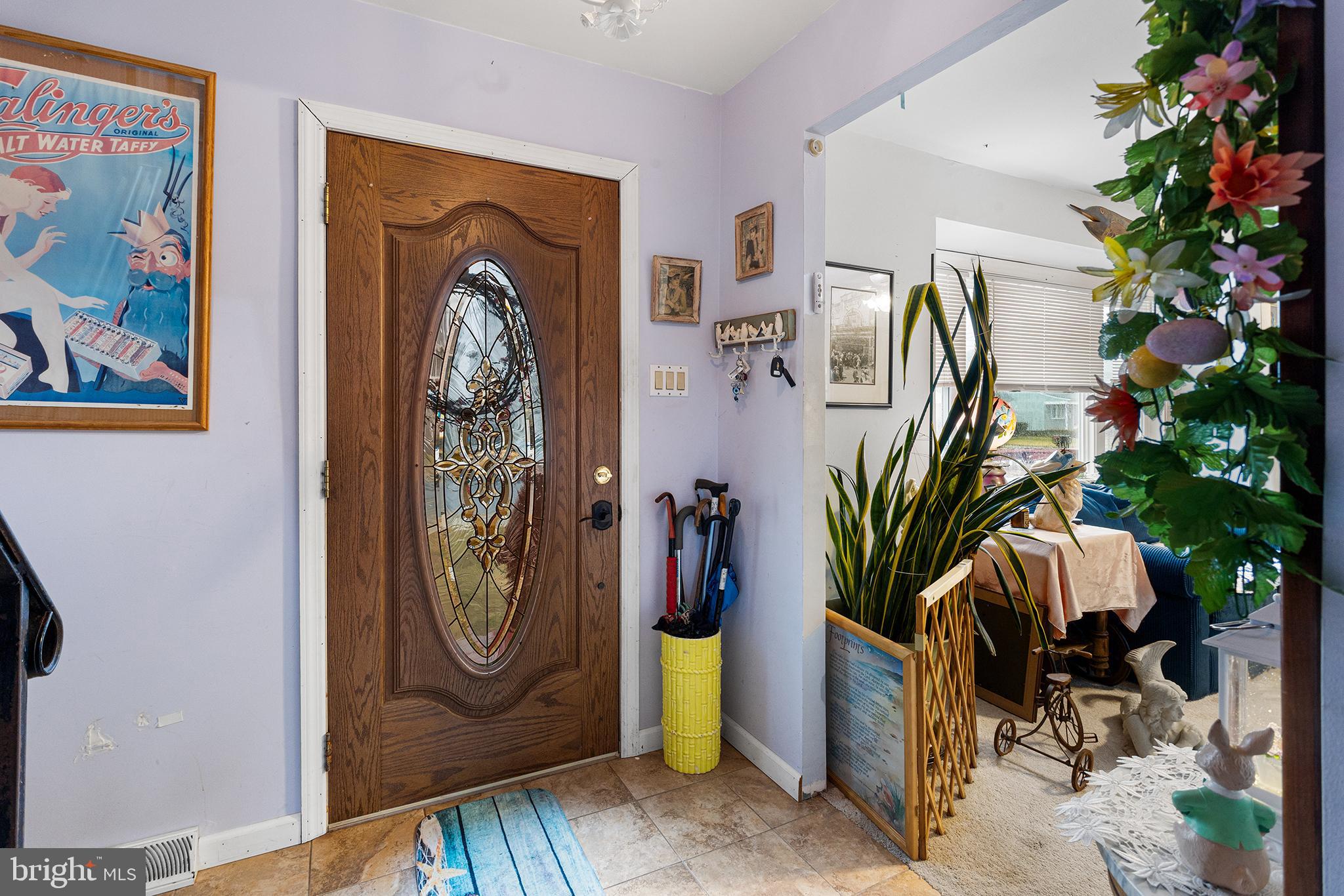 45 Heald Road Brigantine, NJ 08203 - Photo 4 of 25 a view of a hallway with paintings on the wall