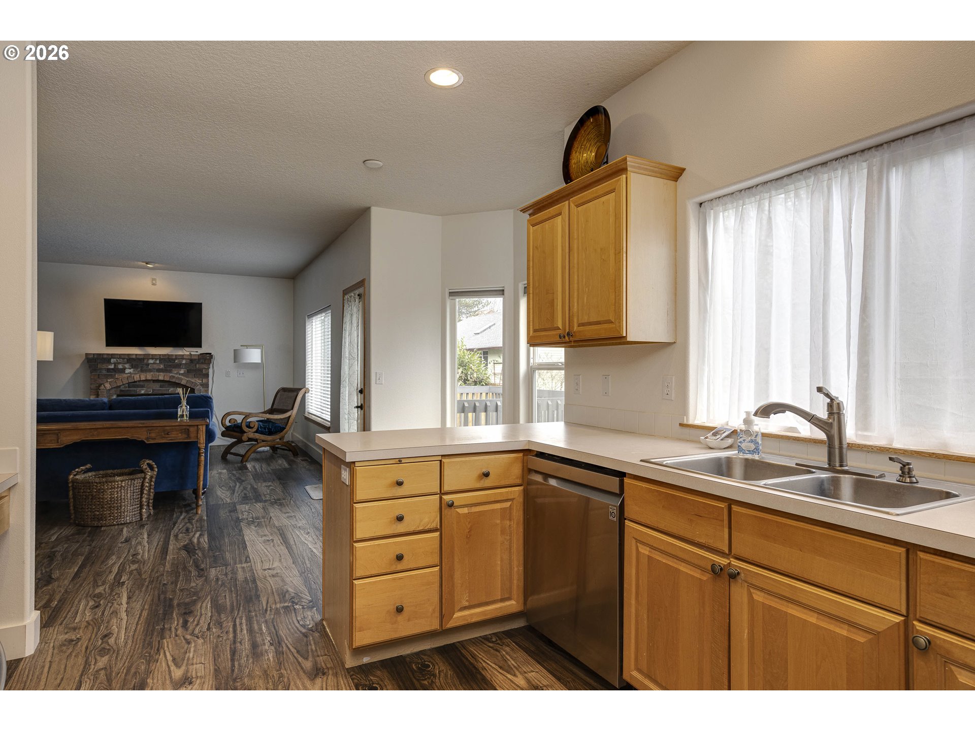 165 Northwest Peach Street Dundee, OR 97115 - Photo 13 of 35 a kitchen with a sink appliances cabinets and a window