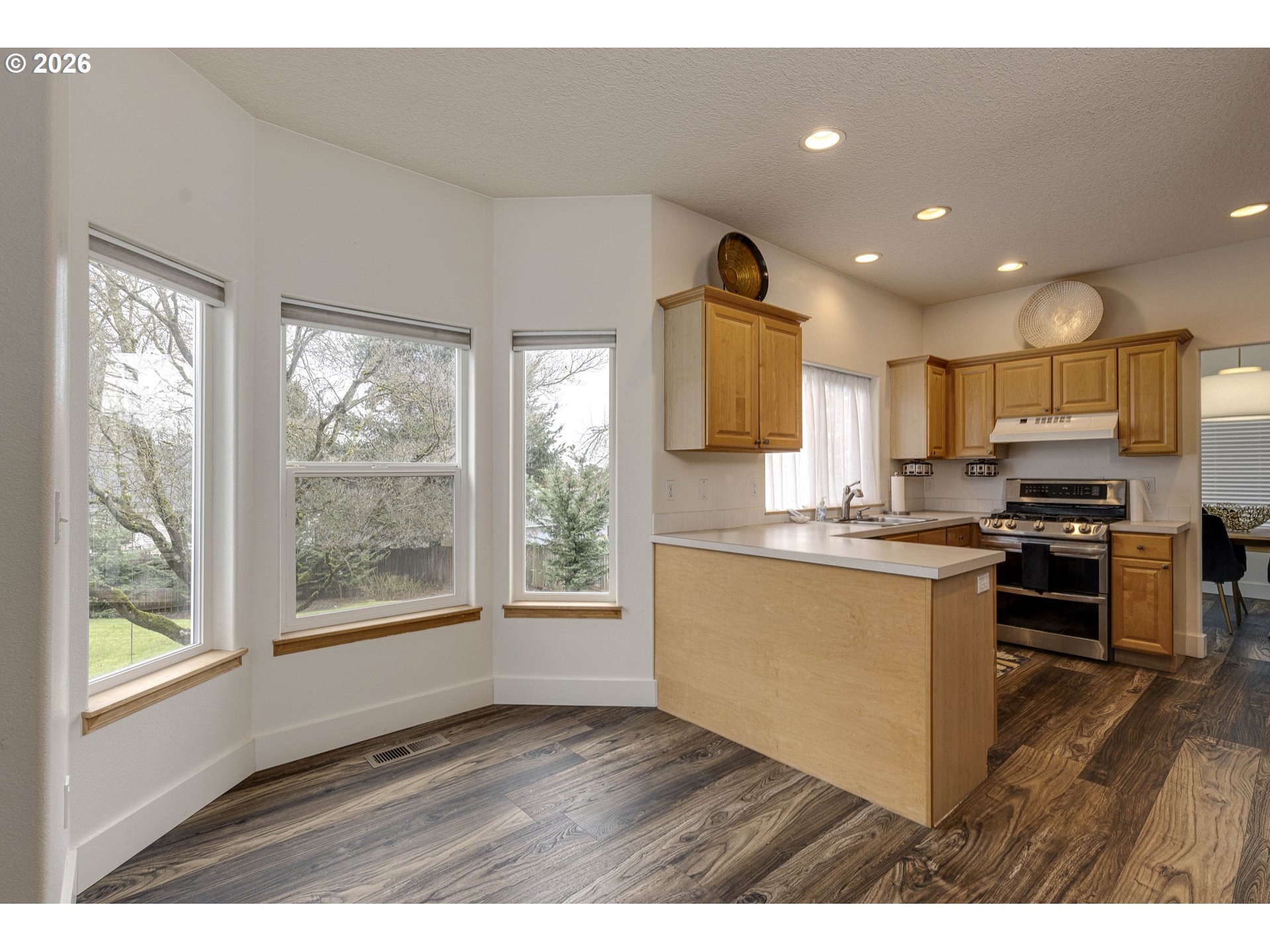 165 Northwest Peach Street Dundee, OR 97115 - Photo 16 of 35 a kitchen with a refrigerator and a stove top oven
