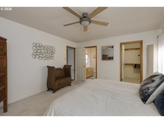 a bathroom with a sink toilet a mirror and shower