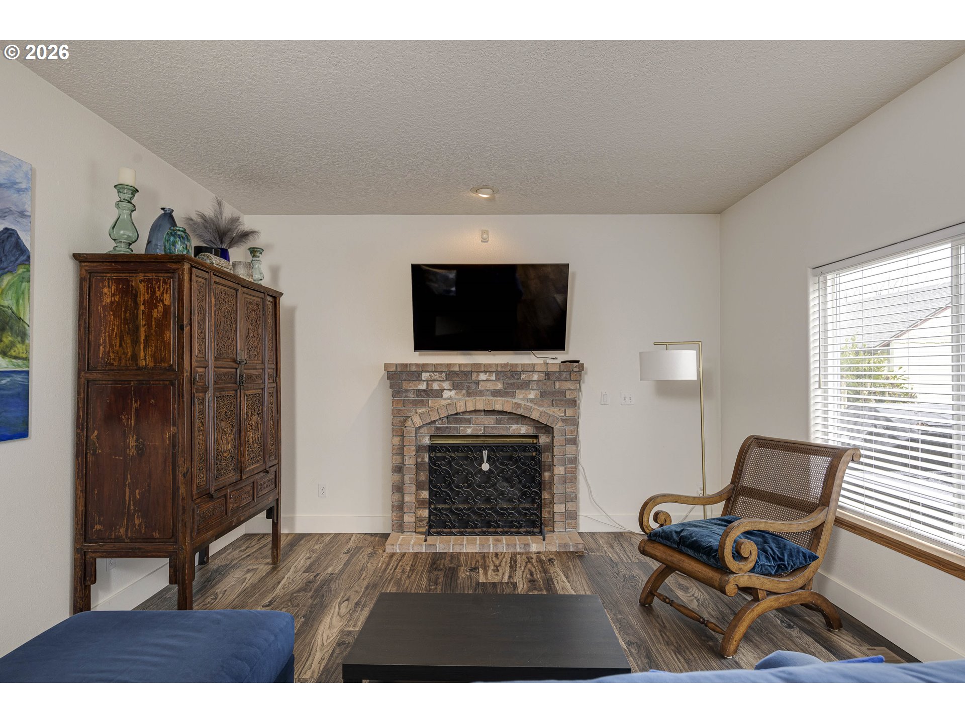 165 Northwest Peach Street Dundee, OR 97115 - Photo 7 of 35 a living room with furniture and a fireplace