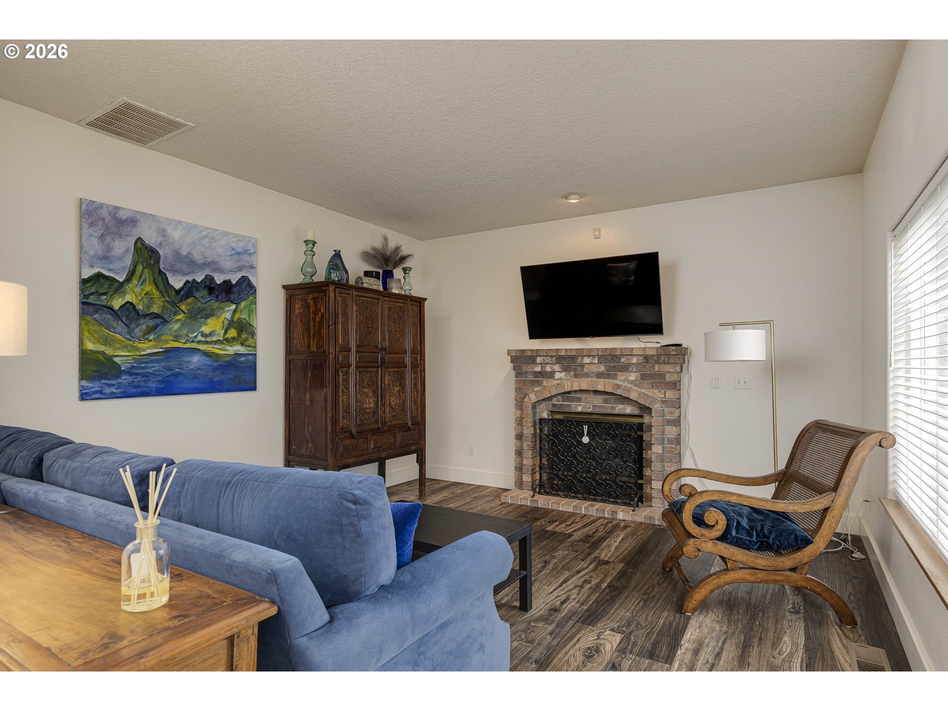 165 Northwest Peach Street Dundee, OR 97115 - Photo 8 of 35 a living room with furniture and a fireplace