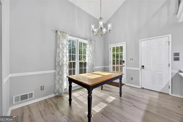 a view of a room with furniture window and wooden floor