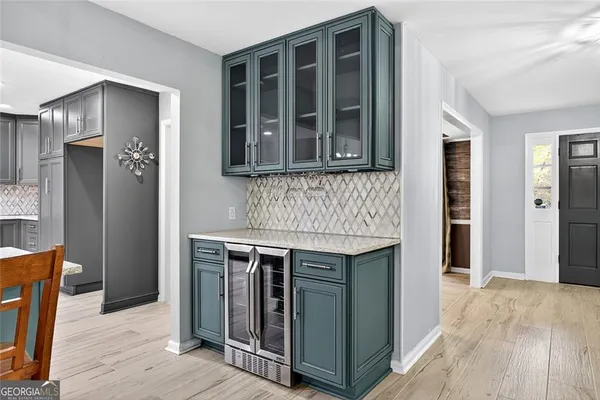 a kitchen with a stove and a kitchen view