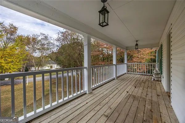 a view of porch with wooden floor