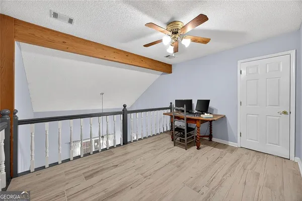 a view of entryway with wooden floor
