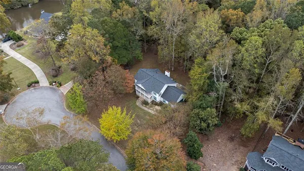 a aerial view of a house with a yard