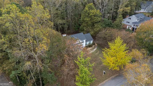 an aerial view of residential house with outdoor space