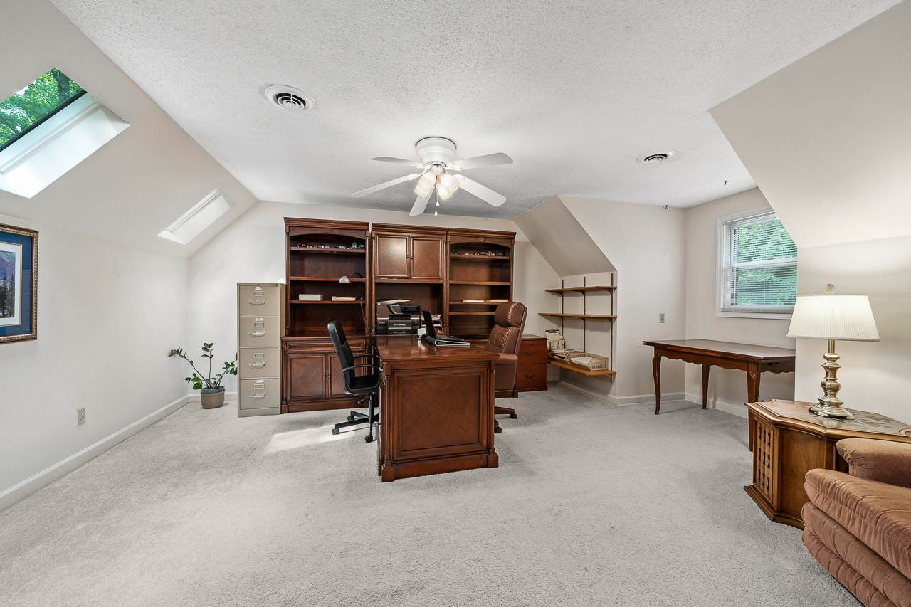 4503 Farrington Road Durham, NC 27707 - Photo 21 of 30 This large bedroom with skylights is being used as an office. Upstairs bedroom #4