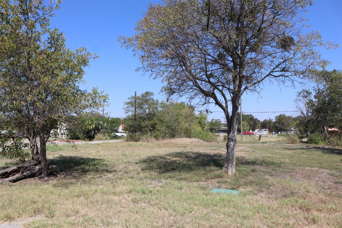 1018 West 1st Street Taylor, TX 76574 - Photo 11 of 17 a view of dirt yard with a tree