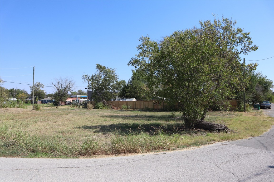 1018 West 1st Street Taylor, TX 76574 - Photo 13 of 17 a view of a yard with large trees