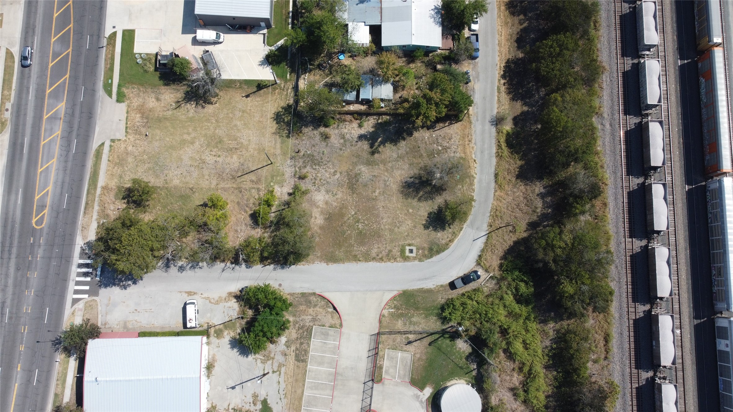 1018 West 1st Street Taylor, TX 76574 - Photo 15 of 17 an aerial view of a residential houses with yard