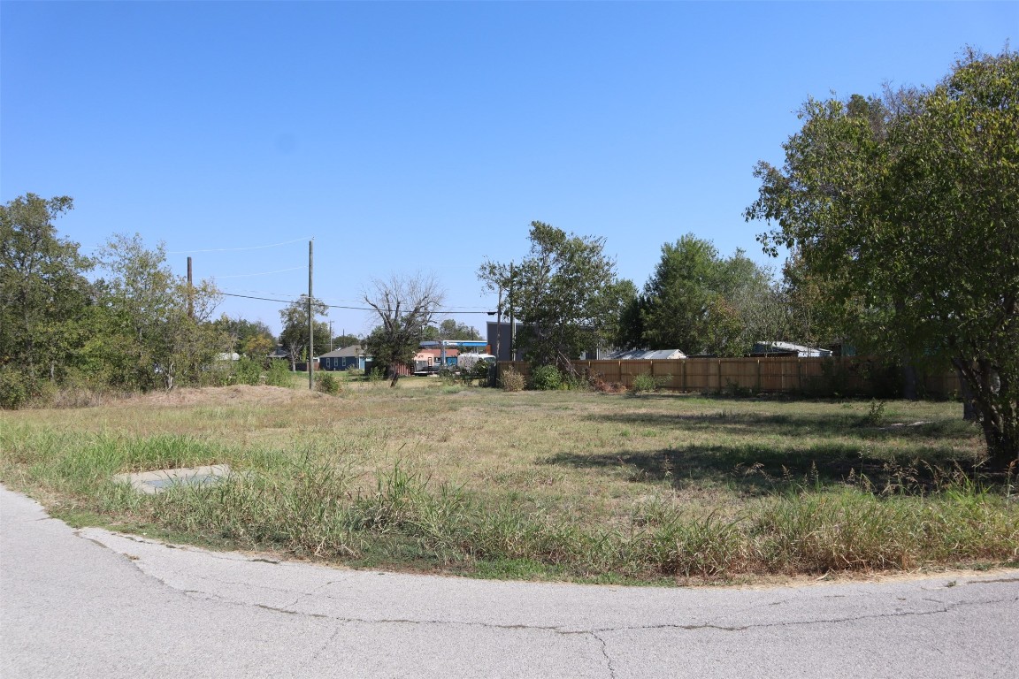 1018 West 1st Street Taylor, TX 76574 - Photo 17 of 17 a view of a field of grass and trees