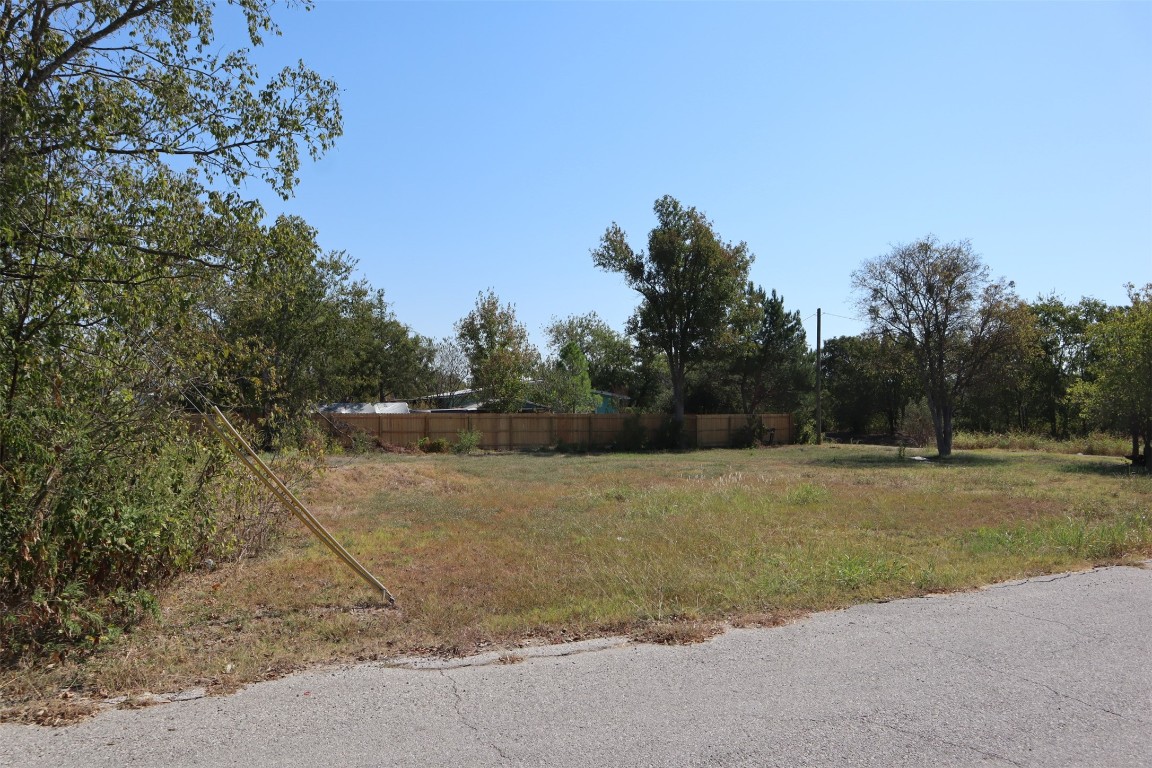 1018 West 1st Street Taylor, TX 76574 - Photo 8 of 17 a view of a field with trees in background