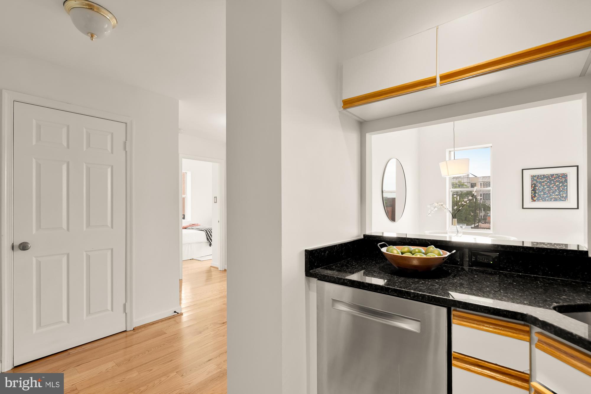 1619 R Street Northwest, Unit 606 Washington, DC 20009 - Photo 12 of 25 a kitchen with a sink and cabinets