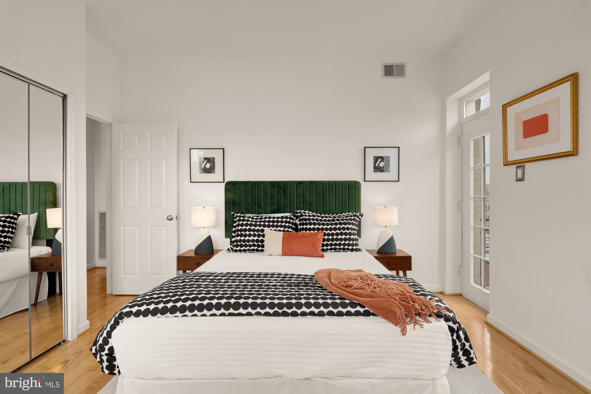 1619 R Street Northwest, Unit 606 Washington, DC 20009 - Photo 14 of 25 a bedroom with a bed and a flat screen tv