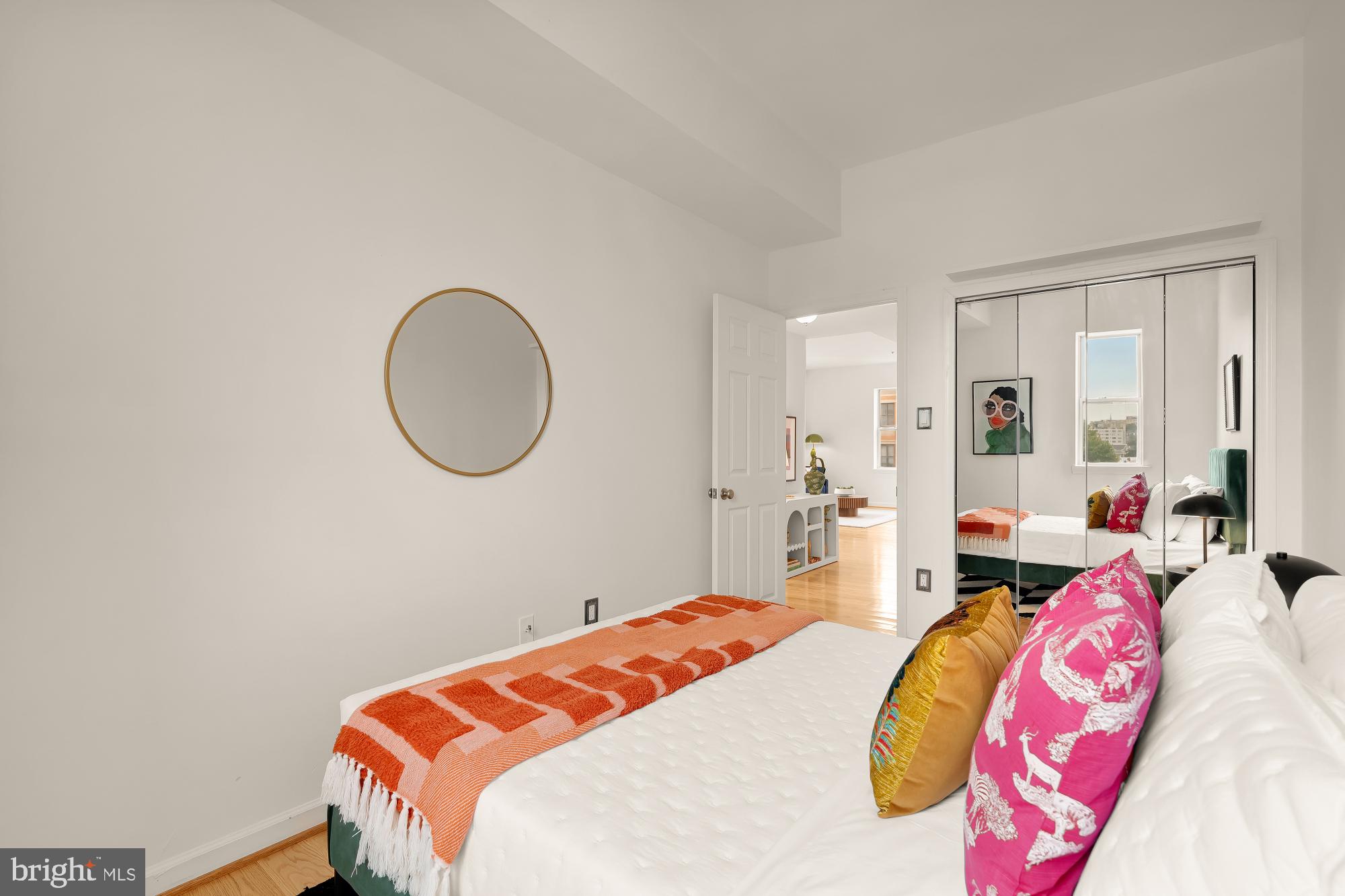 1619 R Street Northwest, Unit 606 Washington, DC 20009 - Photo 18 of 25 a bedroom with bed and a mirror