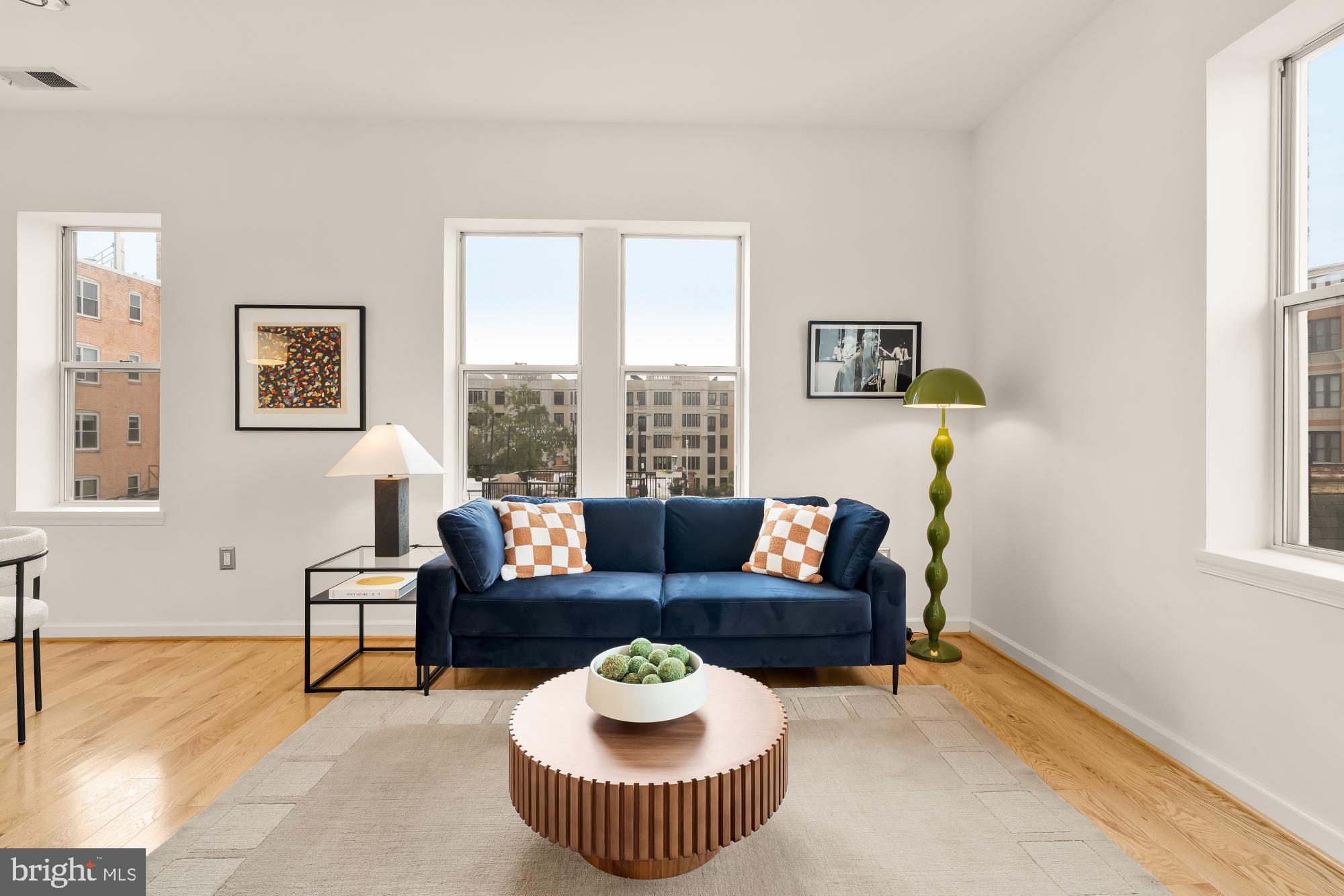 1619 R Street Northwest, Unit 606 Washington, DC 20009 - Photo 8 of 25 a living room with furniture and a window