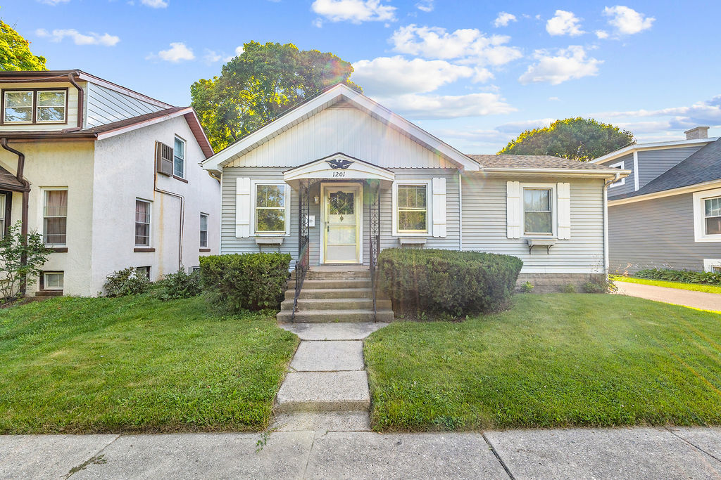 1201 North McKinley Road Lake Forest, IL 60045 - Photo 2 of 17 a view of a house with a big yard plants and large tree