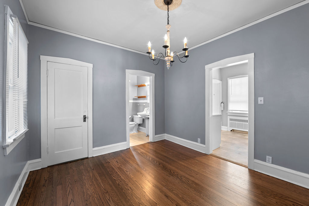 1201 North McKinley Road Lake Forest, IL 60045 - Photo 7 of 17 a view of an empty room with wooden floor and a window