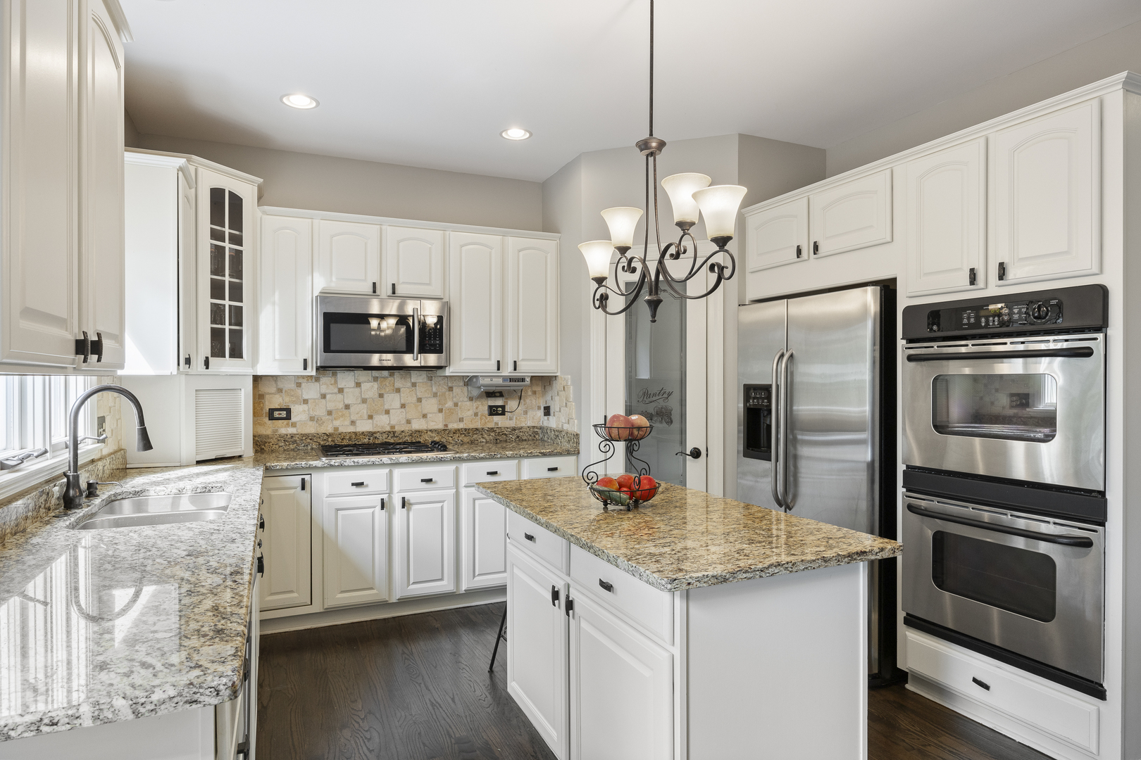 2177 Red Maple Lane Aurora, IL 60502 - Photo 12 of 40 a kitchen with stainless steel appliances granite countertop a sink refrigerator and microwave