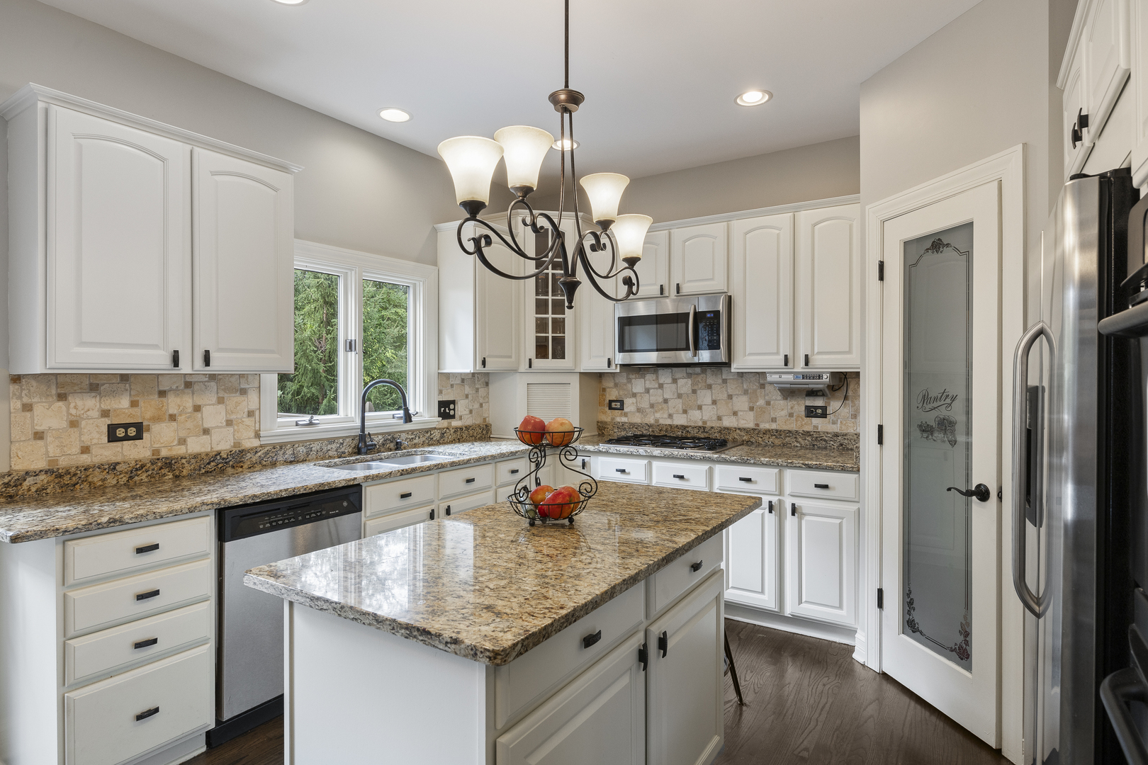 2177 Red Maple Lane Aurora, IL 60502 - Photo 13 of 40 a kitchen with stainless steel appliances granite countertop a sink stove and refrigerator