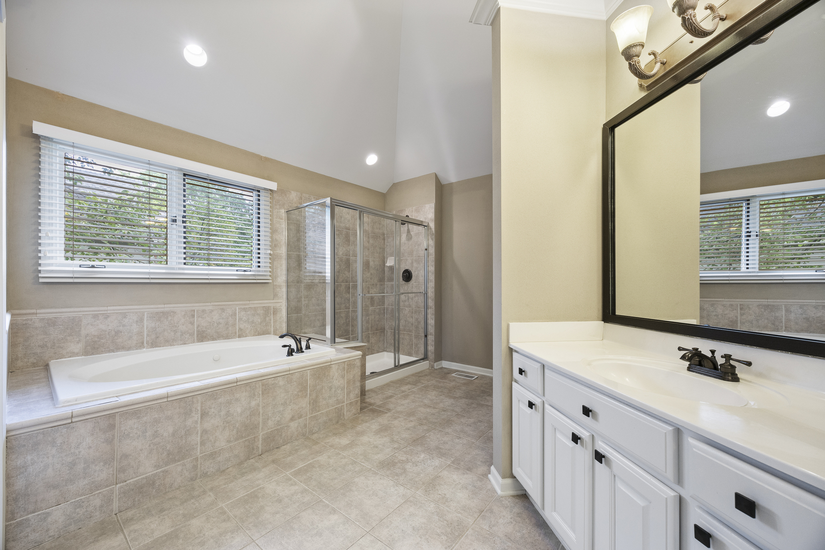 2177 Red Maple Lane Aurora, IL 60502 - Photo 22 of 40 a spacious bathroom with a granite countertop tub sink and mirror