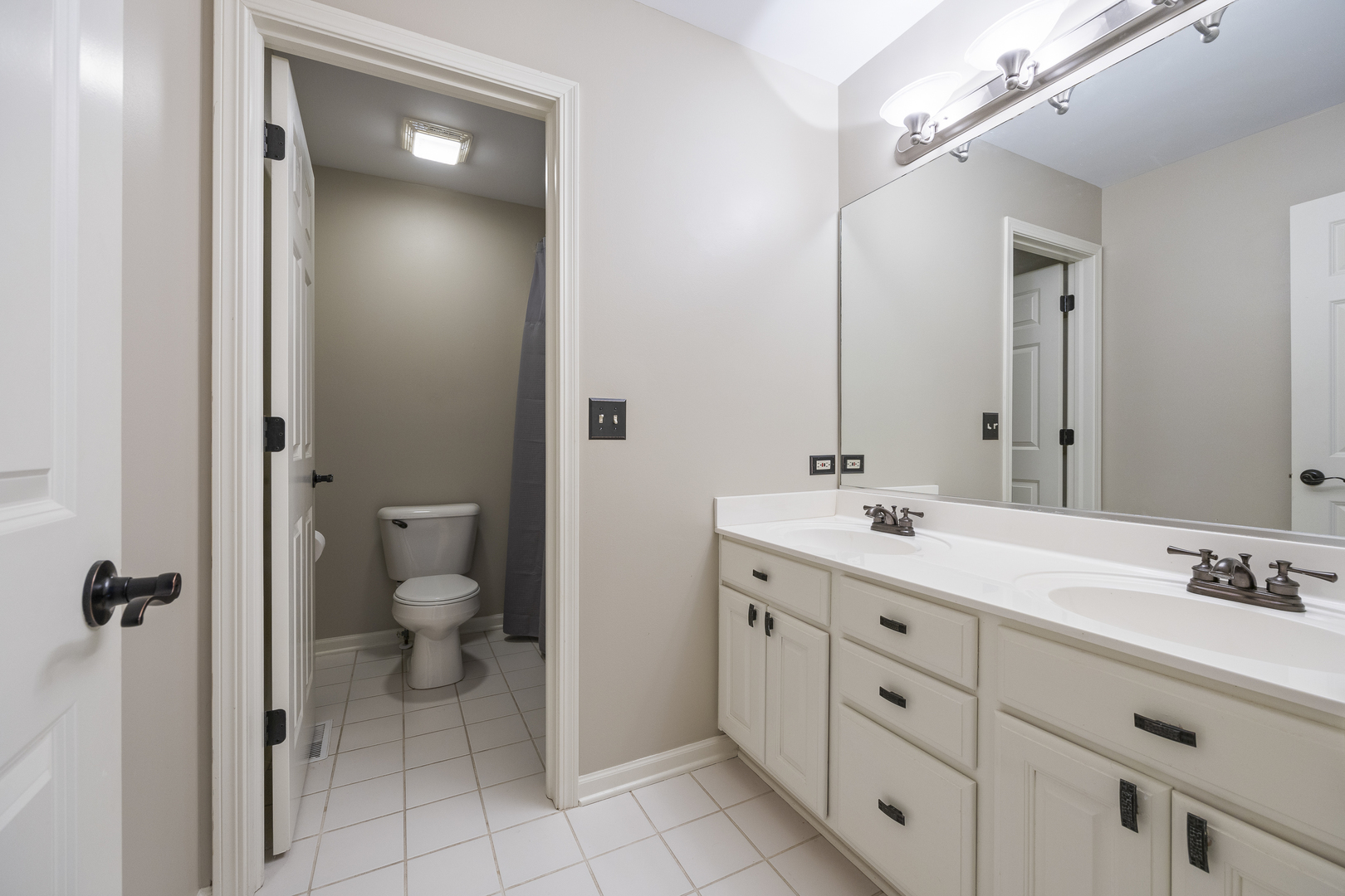 2177 Red Maple Lane Aurora, IL 60502 - Photo 25 of 40 a spacious bathroom with a double vanity sink a mirror and a toilet