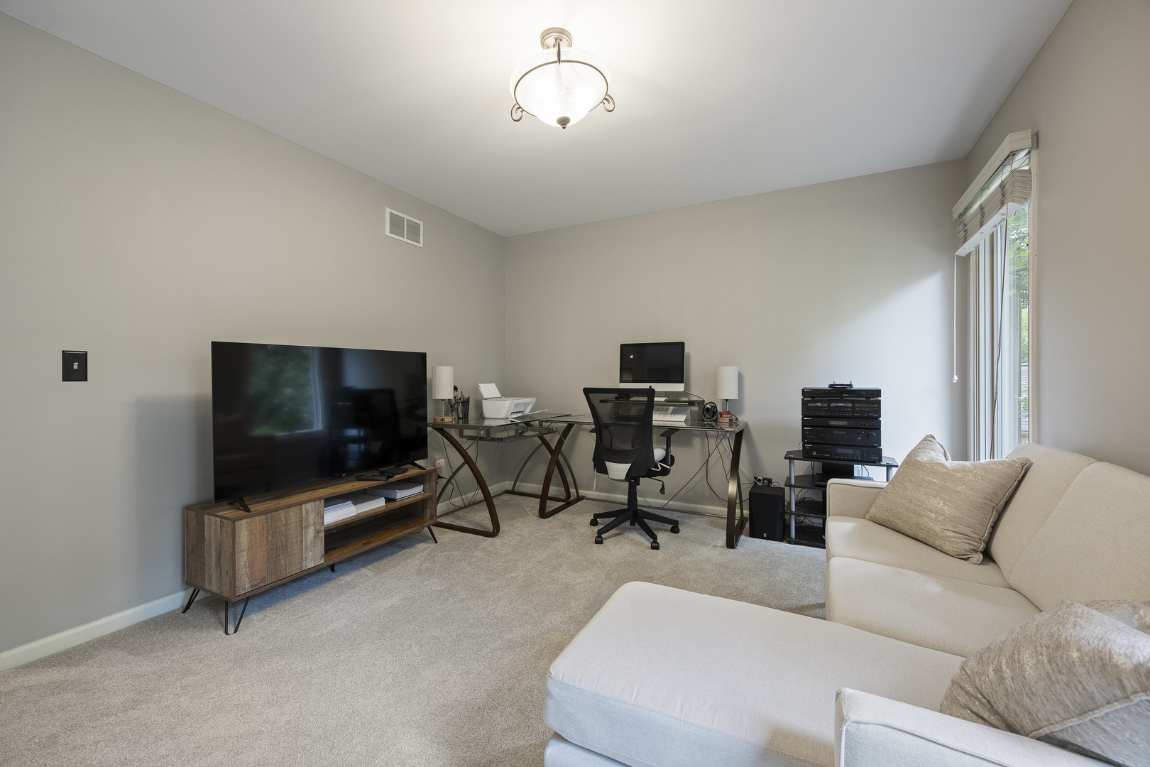 2177 Red Maple Lane Aurora, IL 60502 - Photo 26 of 40 a living room with furniture and a flat screen tv