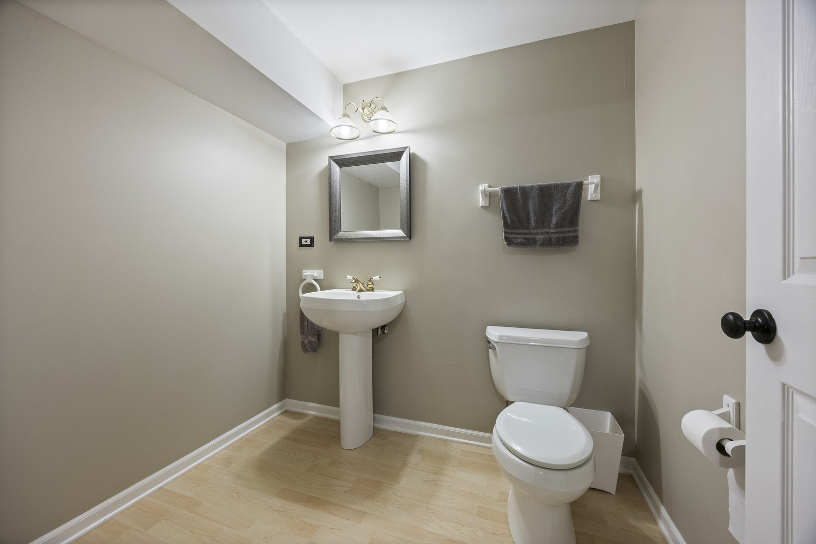 2177 Red Maple Lane Aurora, IL 60502 - Photo 30 of 40 a bathroom with a toilet sink and mirror