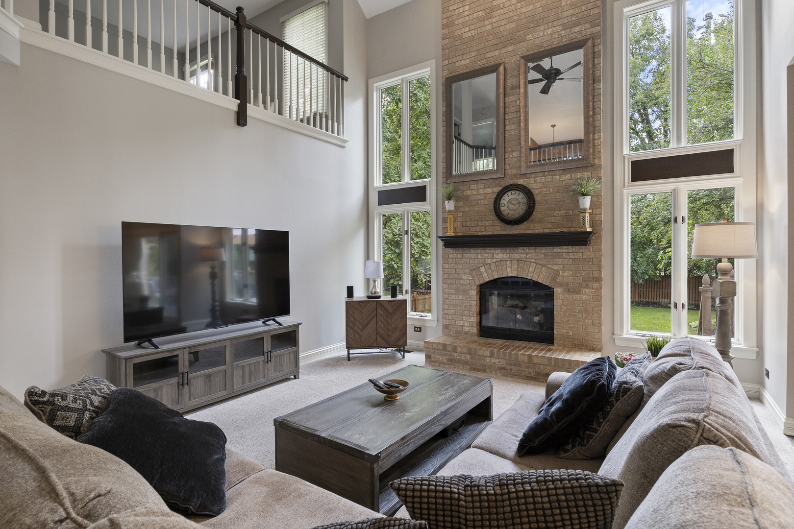 2177 Red Maple Lane Aurora, IL 60502 - Photo 6 of 40 a living room with furniture a flat screen tv and a fireplace
