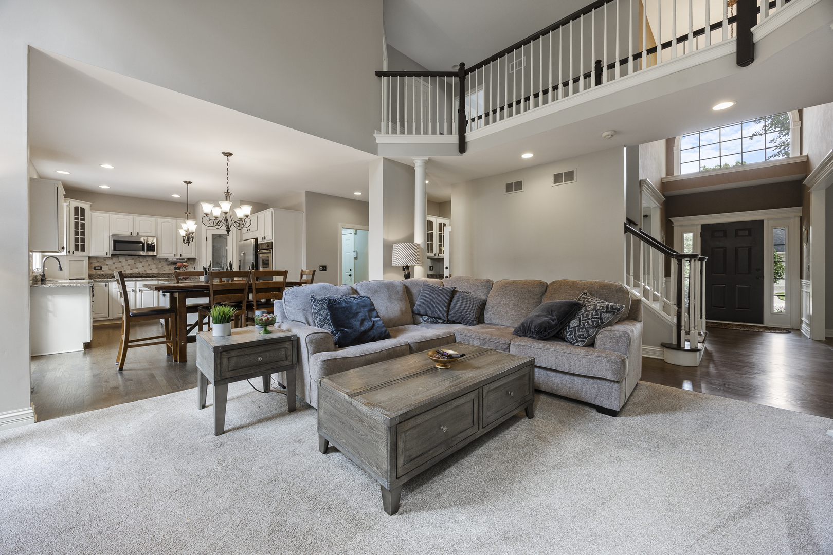 2177 Red Maple Lane Aurora, IL 60502 - Photo 7 of 40 a living room with furniture kitchen view and a chandelier